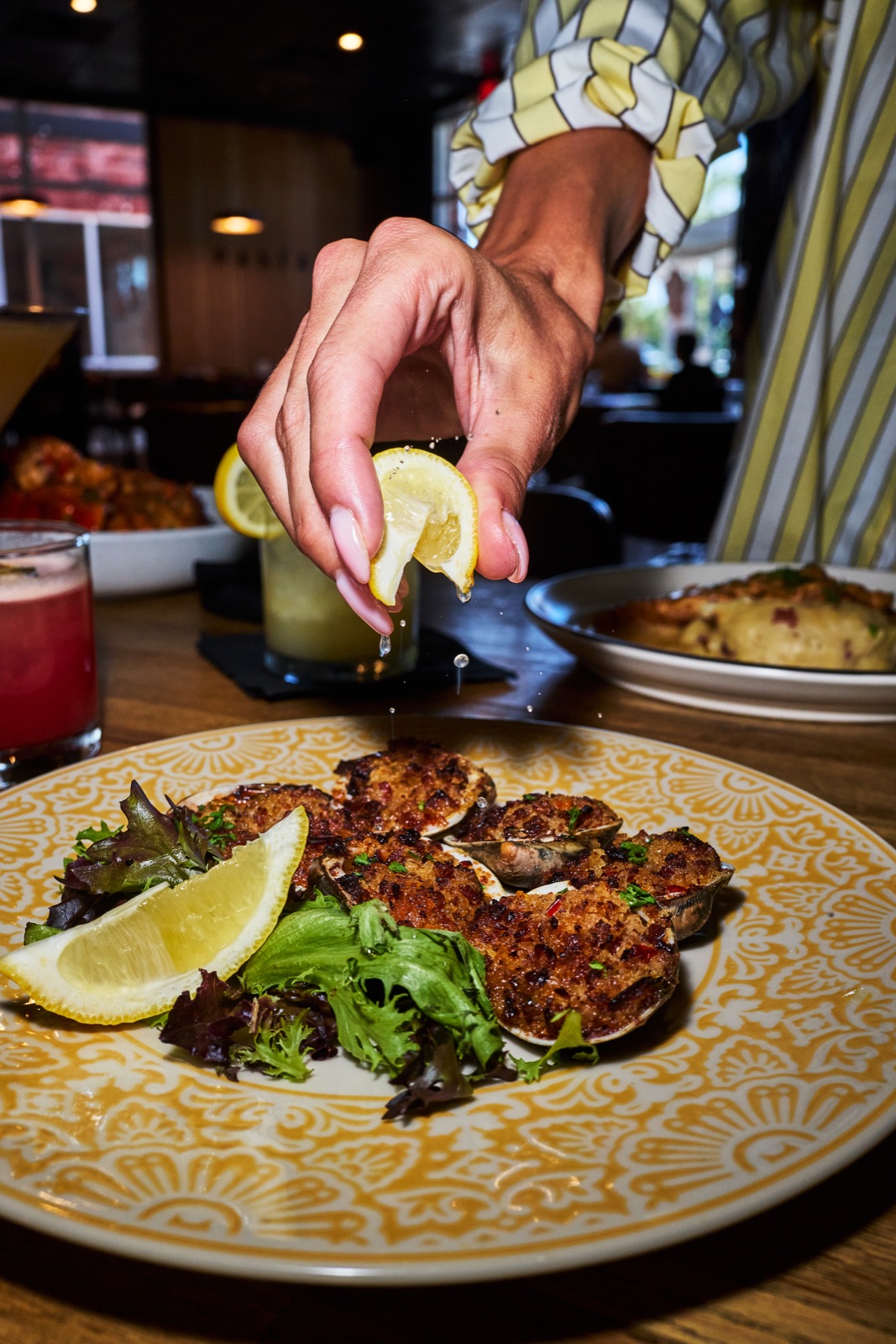 Fresh lemon squeezed over baked clams