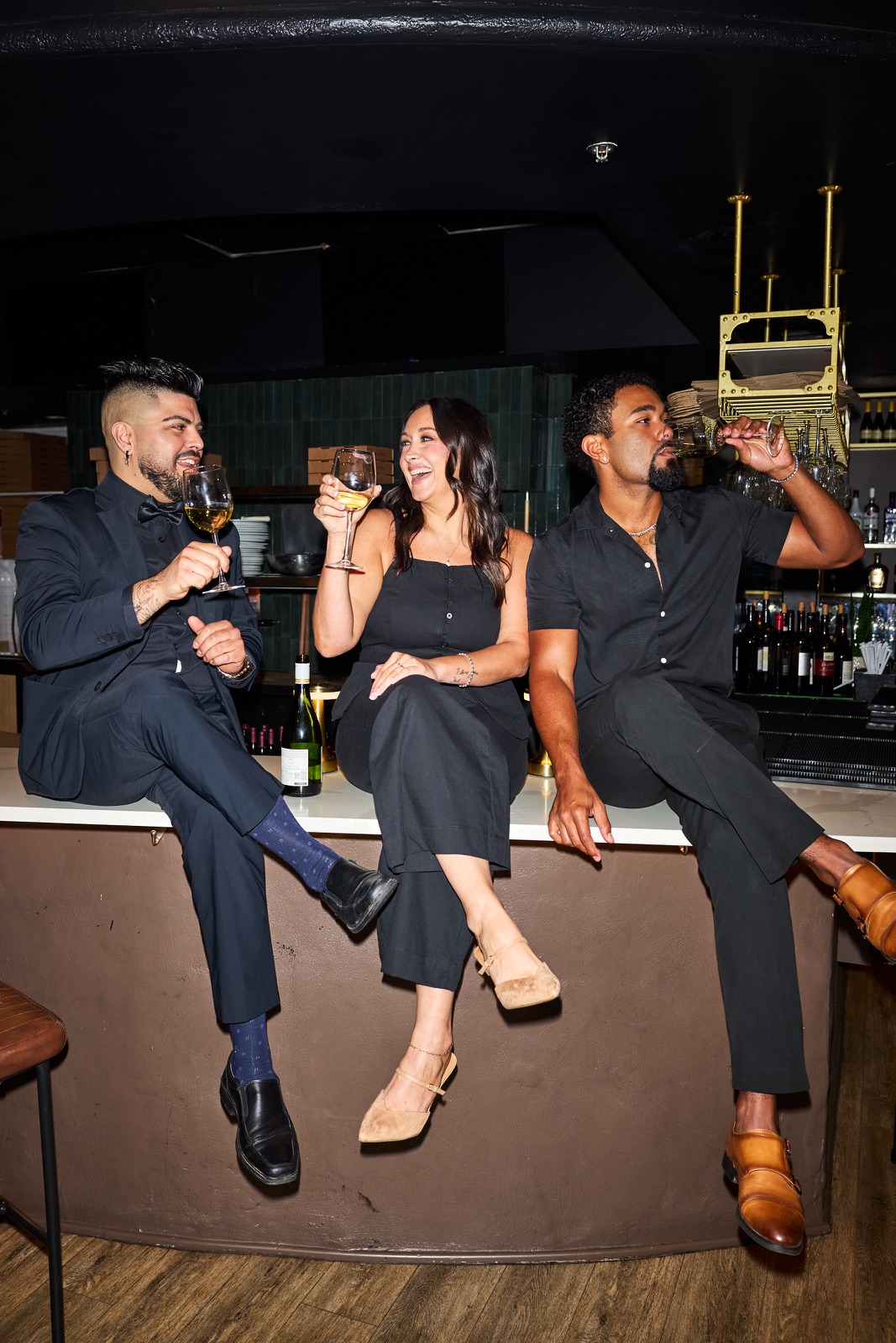 Three friends sharing a moment at the Pastaio bar