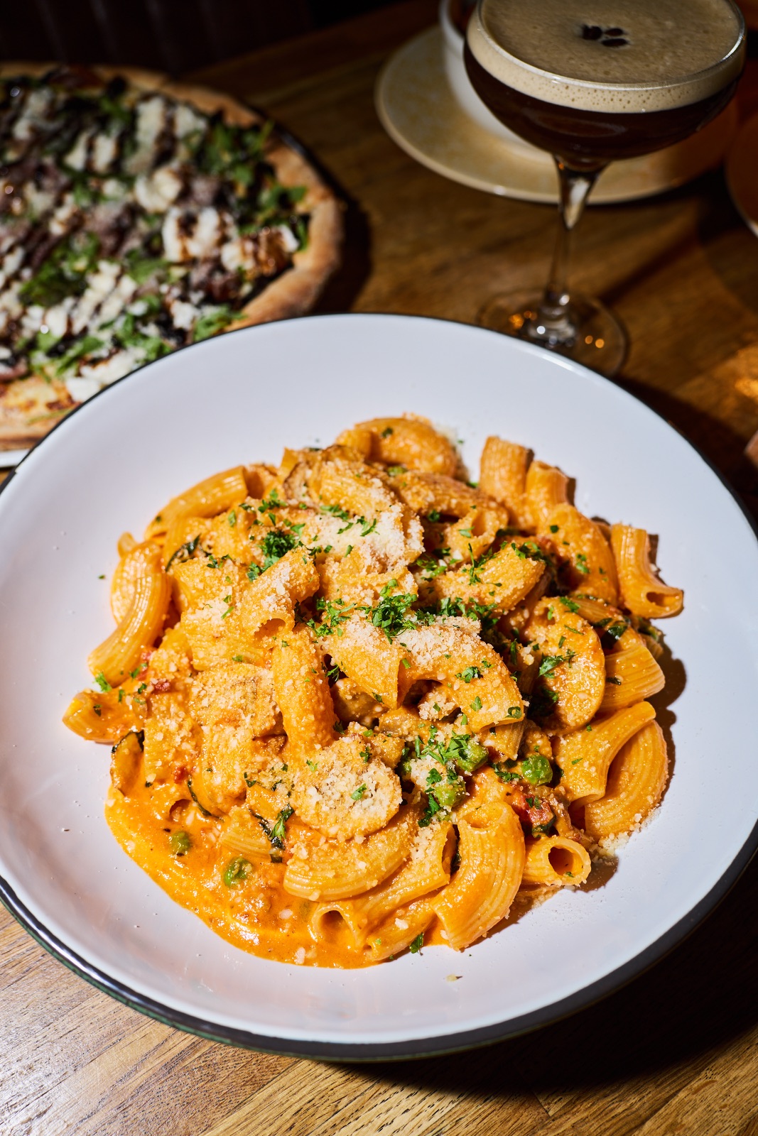 Rigatoni with creamy sauce, peas and parmesan
