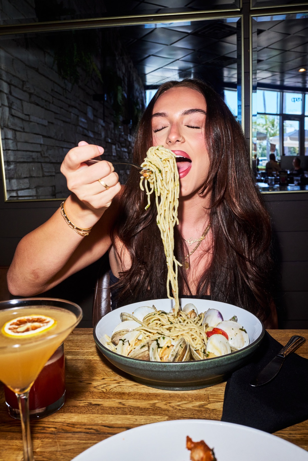 Guest tasting spaghetti with clams